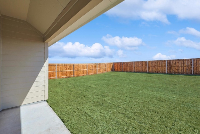 view of yard with a fenced backyard