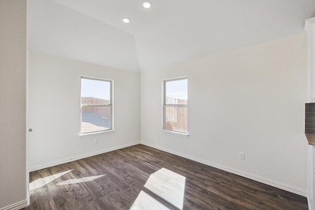 2511 Ridgecrest Ln, Sherman, TX 75092 - spare room featuring plenty of natural light, wood finished floors, baseboards, vaulted ceiling, and recessed lighting