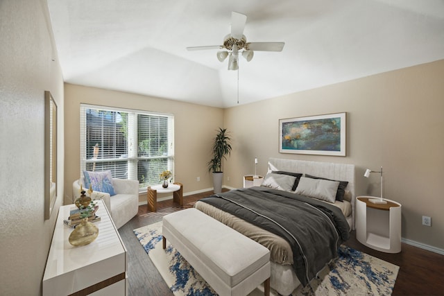 bedroom with dark wood-type flooring, ceiling fan, and lofted ceiling