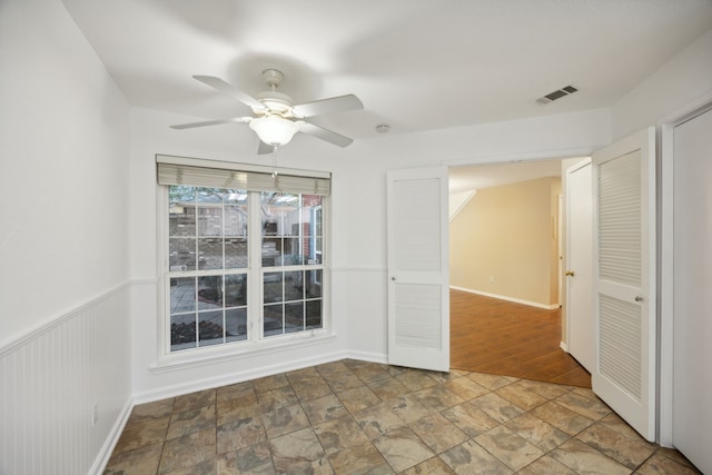 unfurnished room with hardwood / wood-style flooring and ceiling fan