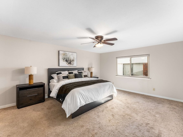 bedroom with light colored carpet and ceiling fan