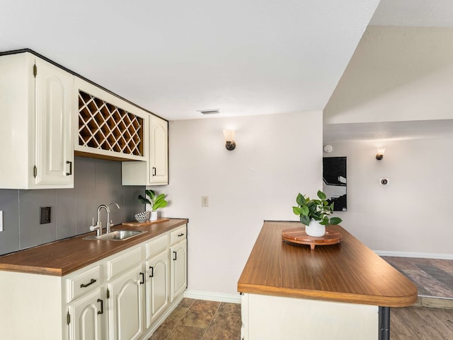 kitchen featuring sink and cream cabinets