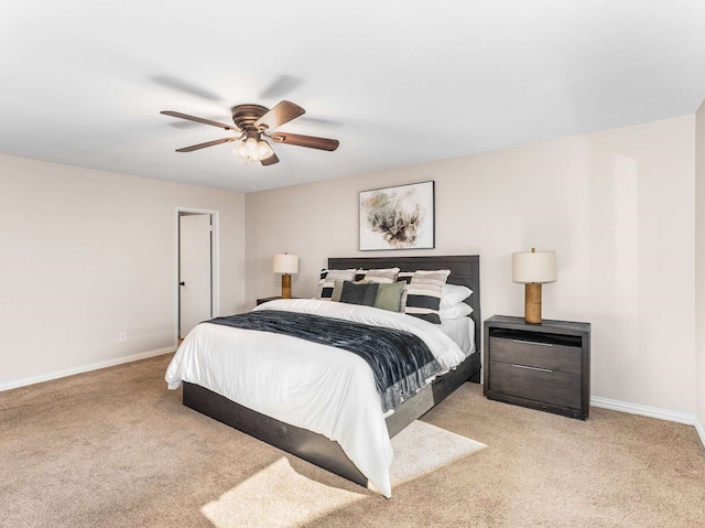 bedroom featuring ceiling fan and light colored carpet