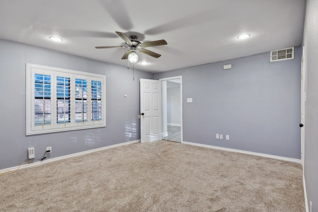 unfurnished room featuring carpet flooring and ceiling fan