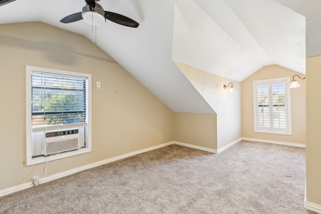 additional living space featuring cooling unit, ceiling fan, vaulted ceiling, and light carpet