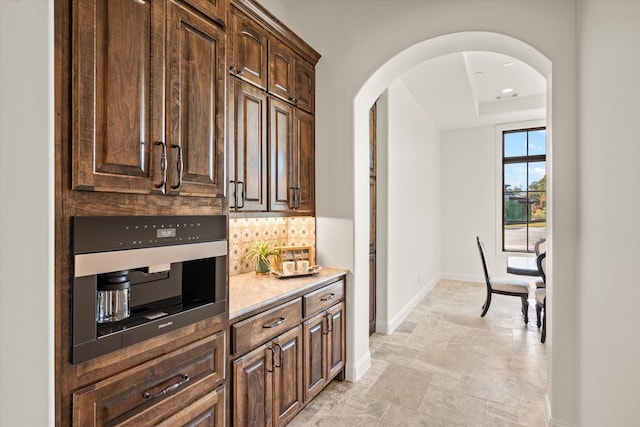 dining room featuring sink and a chandelier