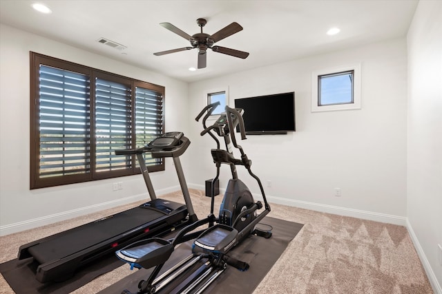 carpeted living room with ceiling fan