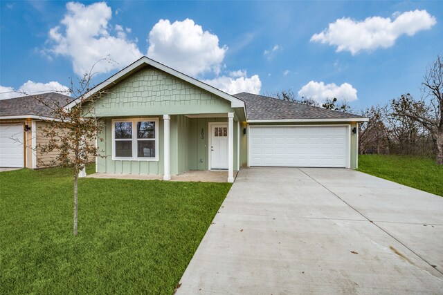 ranch-style house with a front yard and a garage