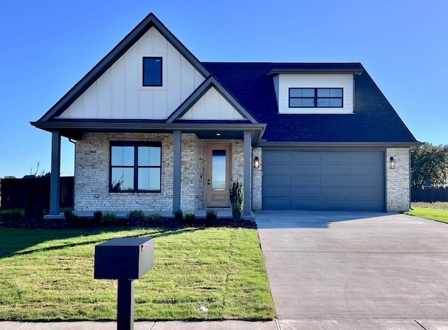 view of front of house featuring a front yard and a garage