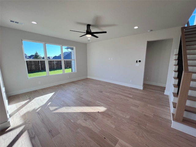 spare room featuring light hardwood / wood-style floors and ceiling fan