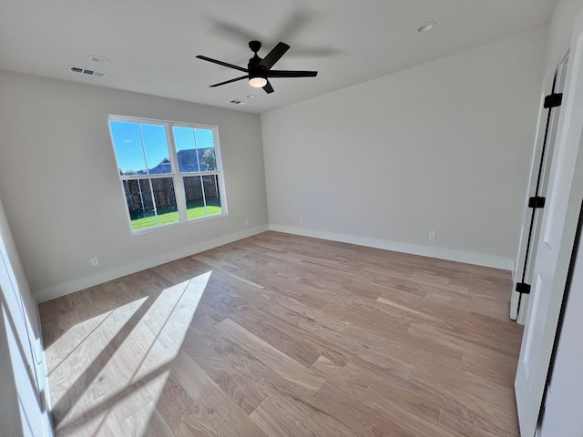 unfurnished room featuring ceiling fan and light hardwood / wood-style floors