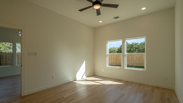 empty room with light hardwood / wood-style floors and ceiling fan