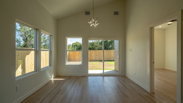 interior space featuring a chandelier and lofted ceiling