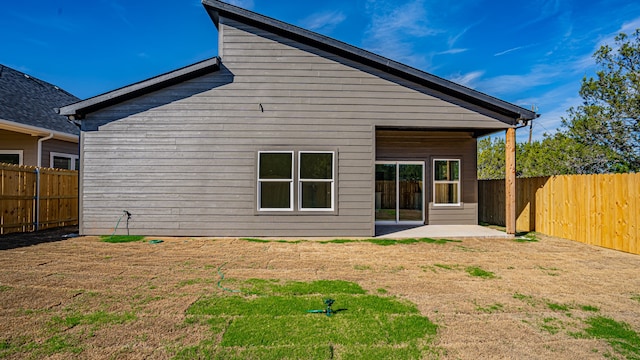 rear view of property featuring a patio