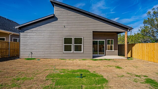 rear view of property featuring a patio