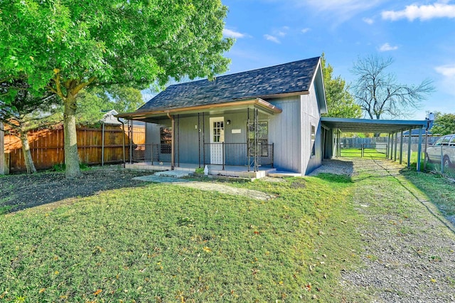 exterior space featuring a lawn and covered porch