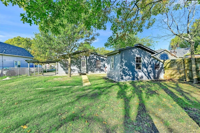 back of house with a yard