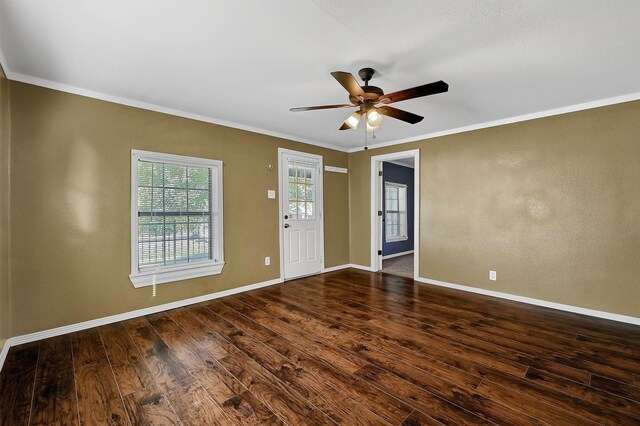 entrance foyer featuring ceiling fan, dark hardwood / wood-style flooring, and ornamental molding