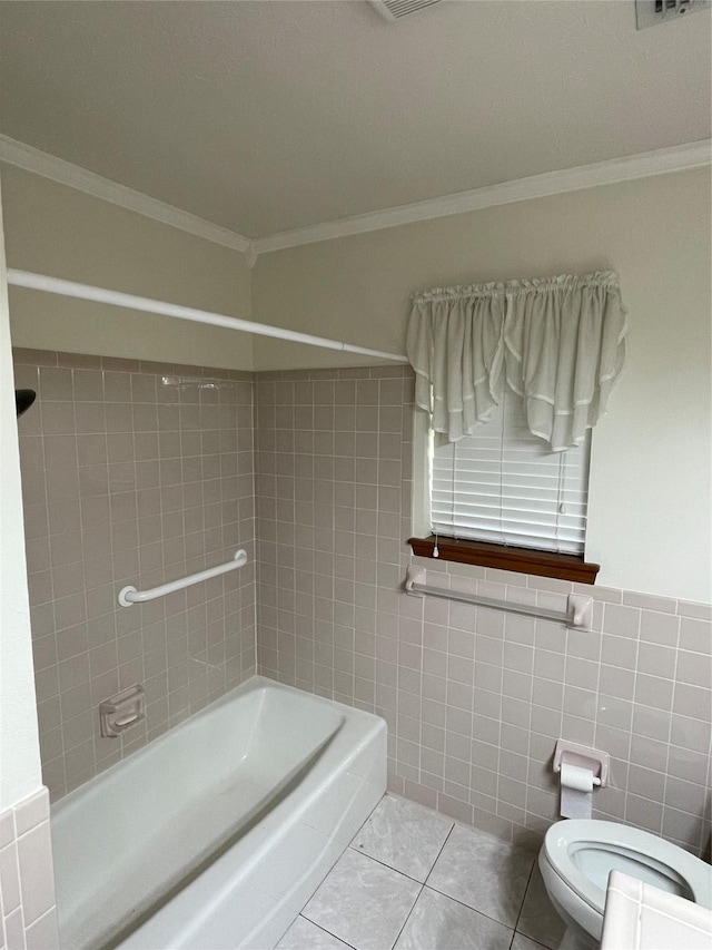 bathroom with crown molding, tile walls, toilet, and tile patterned floors