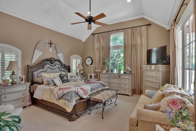 carpeted bedroom with ceiling fan, ornamental molding, and vaulted ceiling