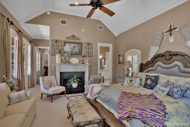 bedroom featuring carpet flooring, connected bathroom, ceiling fan, and crown molding