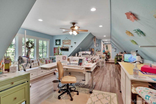 office with ceiling fan, light hardwood / wood-style flooring, and lofted ceiling