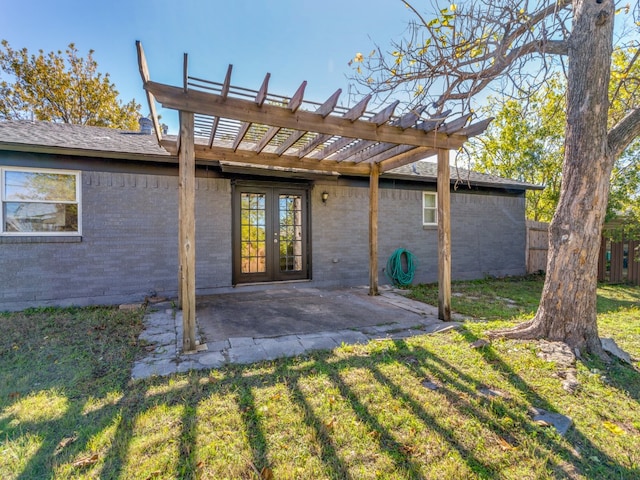 back of house featuring a patio area, a pergola, a yard, and french doors