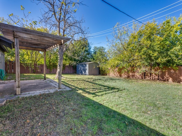 view of yard with a pergola, a storage unit, and a patio area