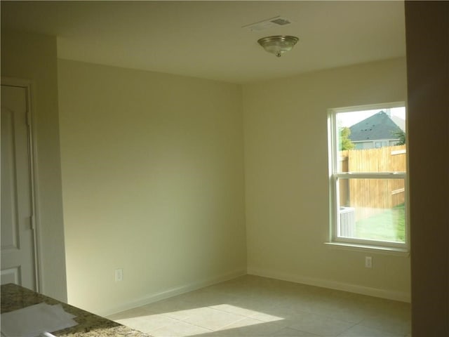 empty room featuring light tile patterned flooring