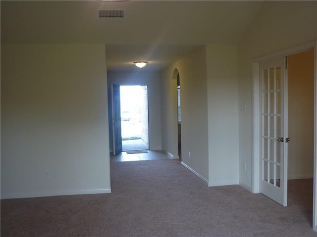 corridor with light colored carpet