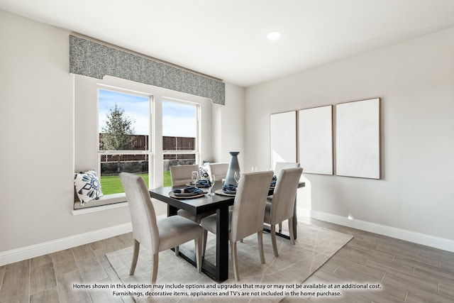 dining area with hardwood / wood-style flooring