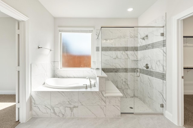 116 Harlan Ct, Aledo, TX 76008 - bathroom with a walk in closet, a garden tub, a stall shower, and baseboards