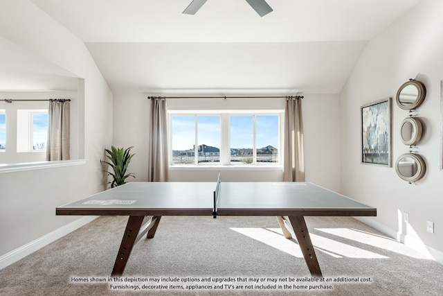 home office featuring ceiling fan, carpet floors, and vaulted ceiling