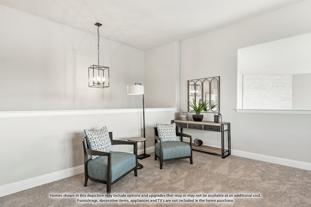 living area featuring light carpet and an inviting chandelier