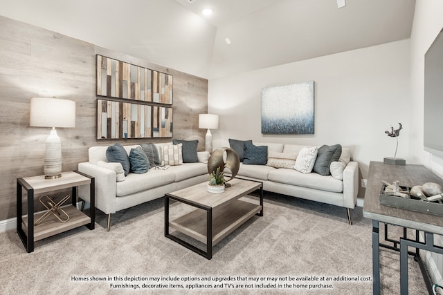 carpeted living room featuring vaulted ceiling