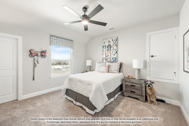 carpeted bedroom with ceiling fan and vaulted ceiling