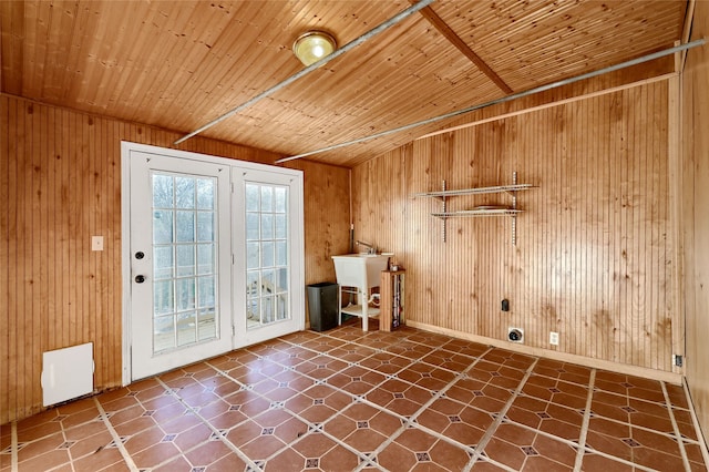 laundry room with wooden walls and wooden ceiling