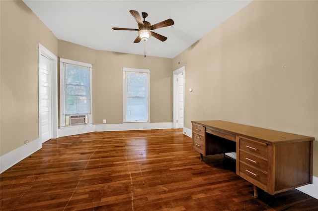 unfurnished office featuring dark hardwood / wood-style flooring, ceiling fan, and cooling unit