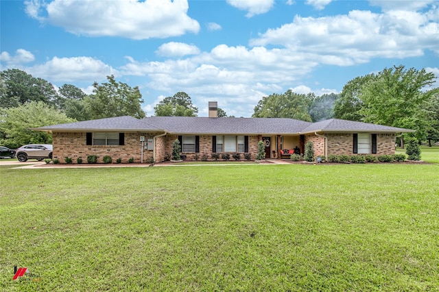 ranch-style house featuring a front lawn