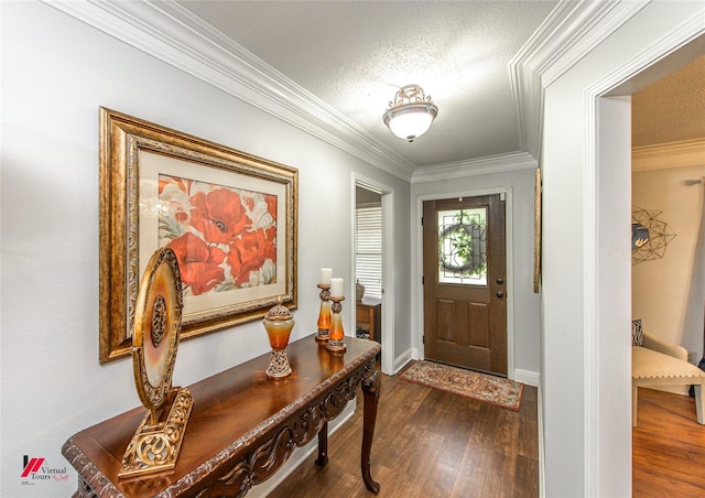 entrance foyer with a textured ceiling, crown molding, and dark wood-type flooring