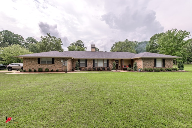 ranch-style house with a front yard