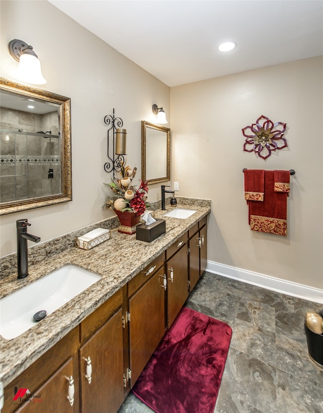 bathroom with vanity and a shower with shower door