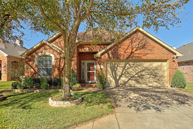 view of property featuring a front yard and a garage