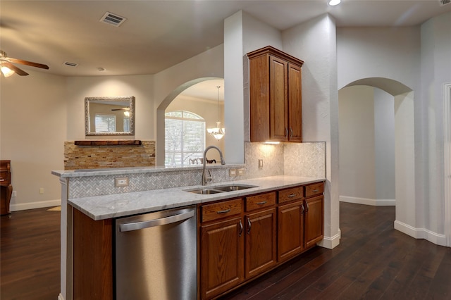 kitchen featuring backsplash, dishwasher, dark hardwood / wood-style floors, and sink