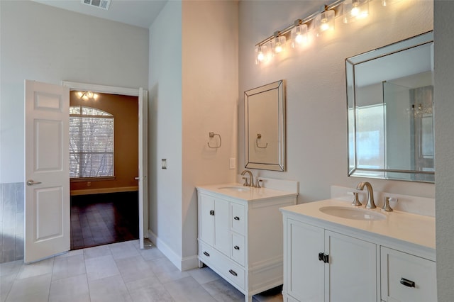 bathroom featuring tile patterned flooring and vanity