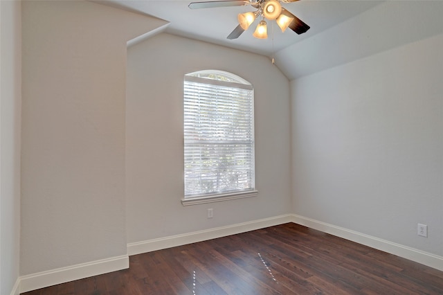 spare room with ceiling fan, dark hardwood / wood-style flooring, and lofted ceiling