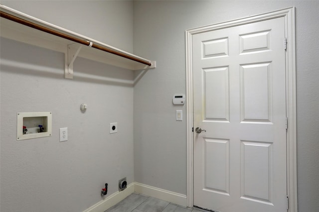 clothes washing area featuring hookup for an electric dryer, hookup for a washing machine, and gas dryer hookup