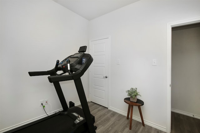 exercise area with dark hardwood / wood-style floors