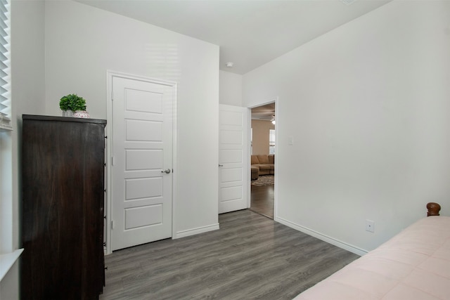 bedroom featuring dark hardwood / wood-style flooring