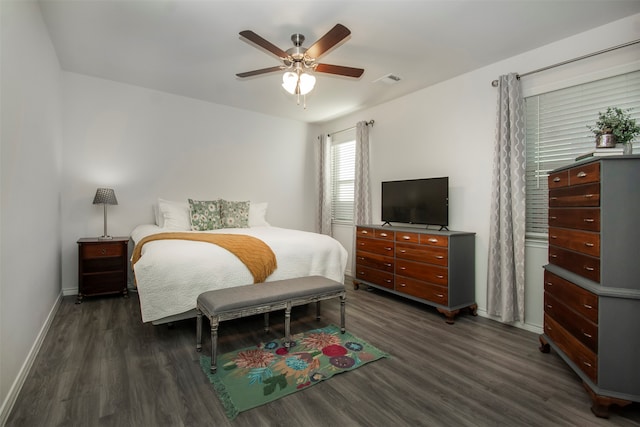 bedroom featuring dark hardwood / wood-style flooring and ceiling fan